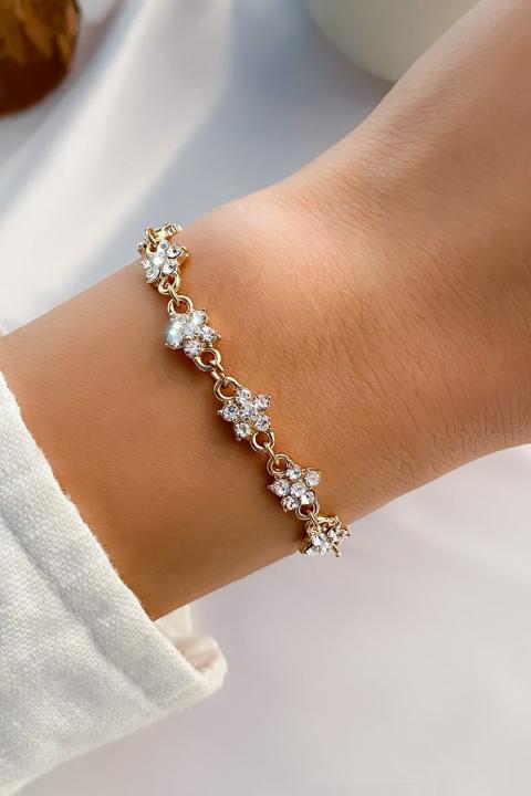 Elegant bracelet with rhinestones, gold color.