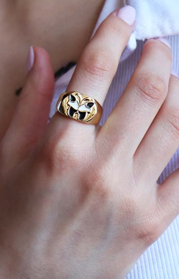 Elegant ring with butterfly motif, gold color.