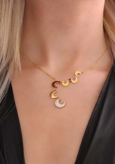 Necklace with moon-shaped pendants, gold color.