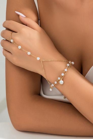 Elegant bracelet with imitation pearls, gold color.